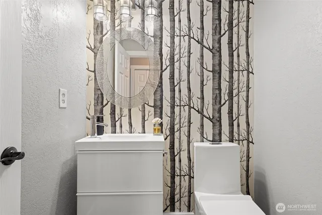 an aerial view of a house with garden space and street view