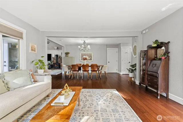 a view of a dining room with furniture wooden floor and chandelier
