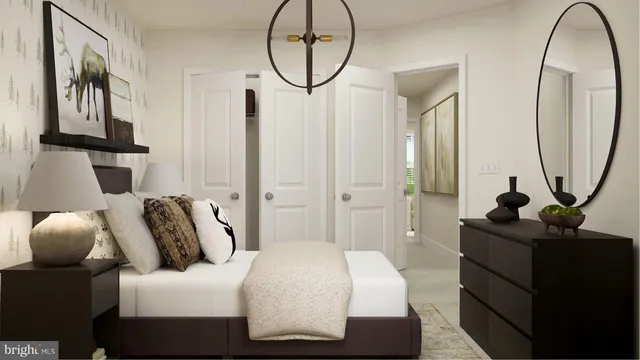 a bedroom with bed and a chandelier