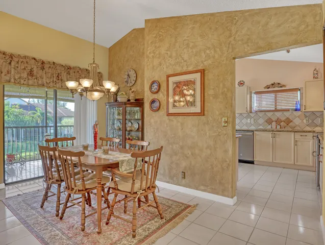 a kitchen with granite countertop cabinets stainless steel appliances and a sink