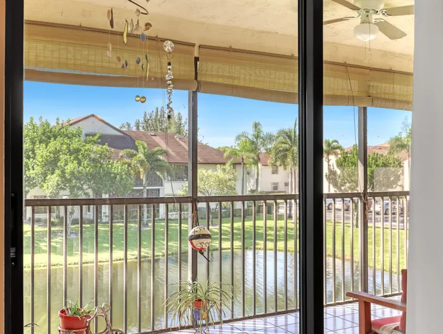 a kitchen with stainless steel appliances kitchen island granite countertop a refrigerator and a stove top oven