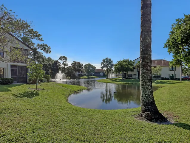 a view of a lake with a house in the background