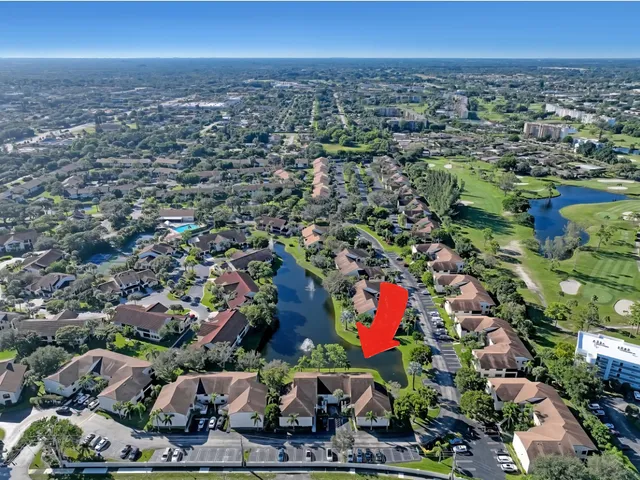 a view of a house with a yard and plants