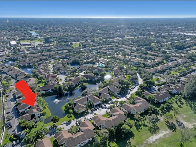 an aerial view of a house with yard