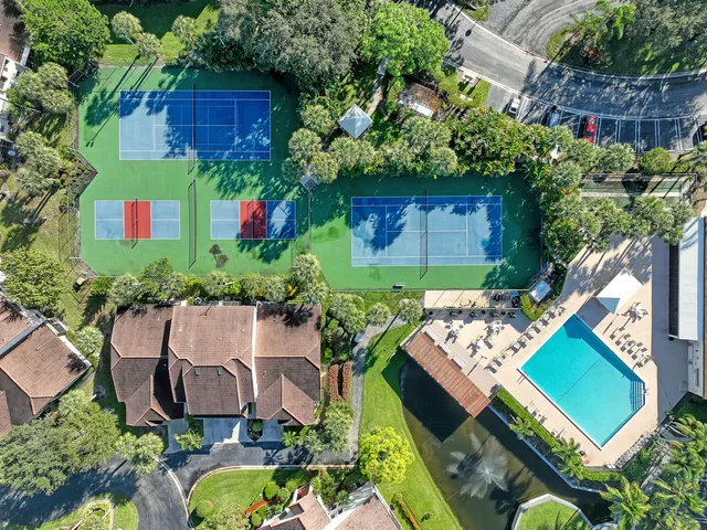 a view of a patio with a table chairs and a backyard