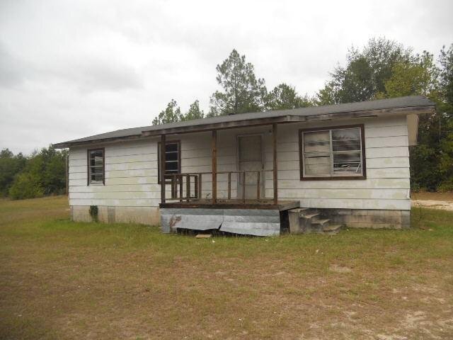823 Sutton Road Dublin, GA 31021 - Photo 1 of 1 a front view of a house with a yard