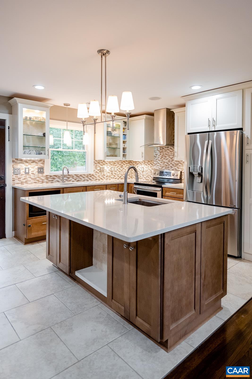 728 Shamrock Road Charlottesville, VA 22903 - Photo 3 of 35 a kitchen with stainless steel appliances granite countertop a sink and a stove