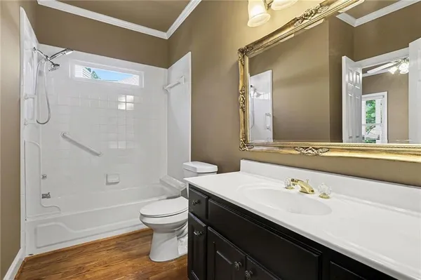 a view of a kitchen with white cabinets
