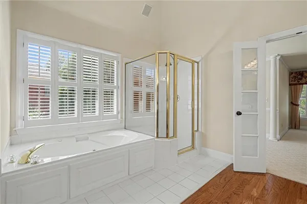 a spacious bathroom with a double vanity sink mirror and