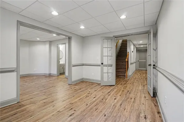 a view of an empty room and wooden floor