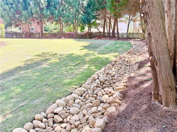 a view of a porch with a table and chairs