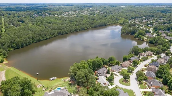 an aerial view of a house with garden space and street view
