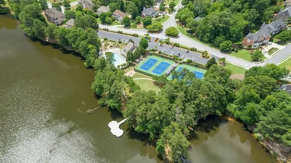 an aerial view of a house with a yard