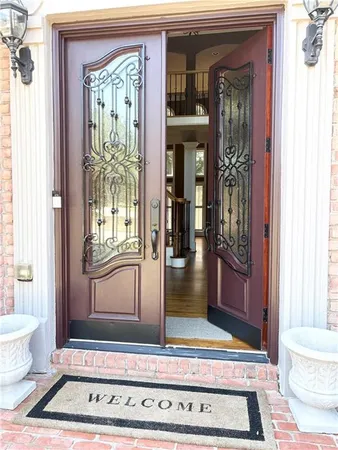 a living room with a rug and a window