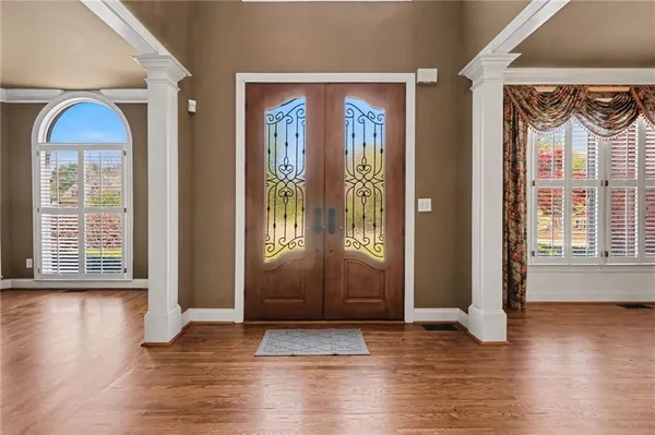 a view of front door with wooden door
