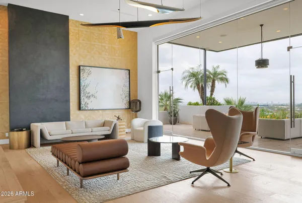 a living room with furniture and a potted plant