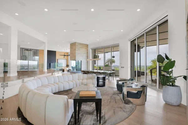 a living room with kitchen and furniture