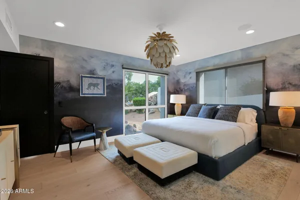 a bedroom with bed and window