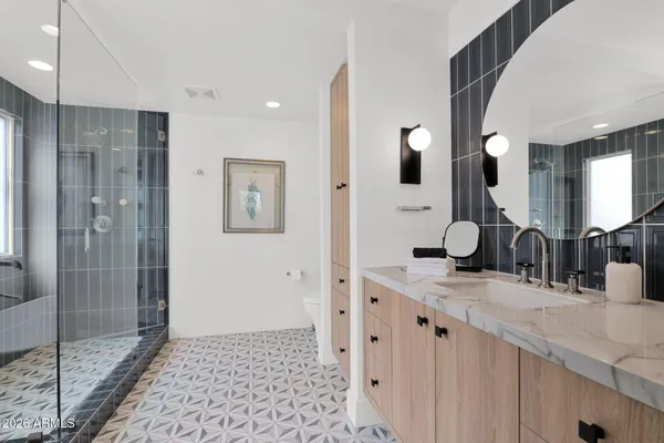 a bathroom with a double vanity sink and mirror