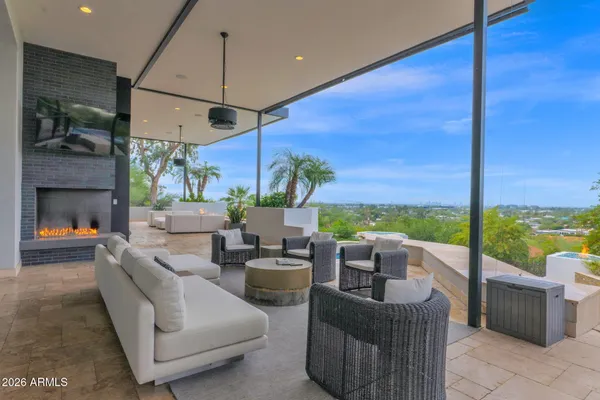 a view of a patio with a table chairs and a table
