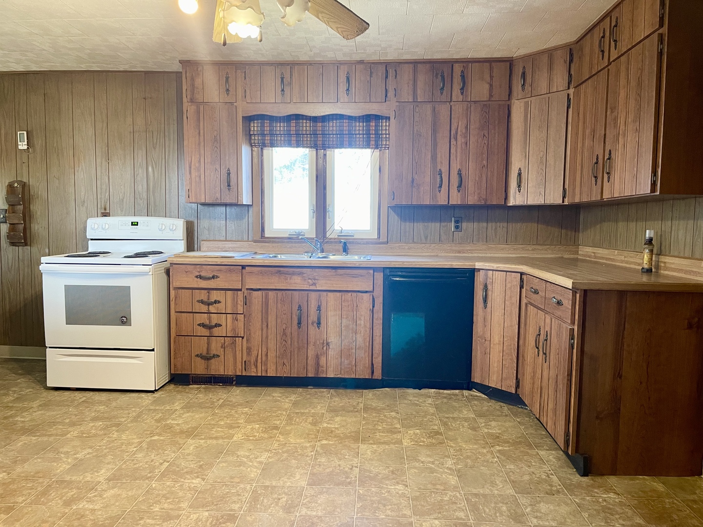3267 East 15th Road Ottawa, IL 61350 - Photo 9 of 21 a kitchen with a stove top oven sink and cabinets