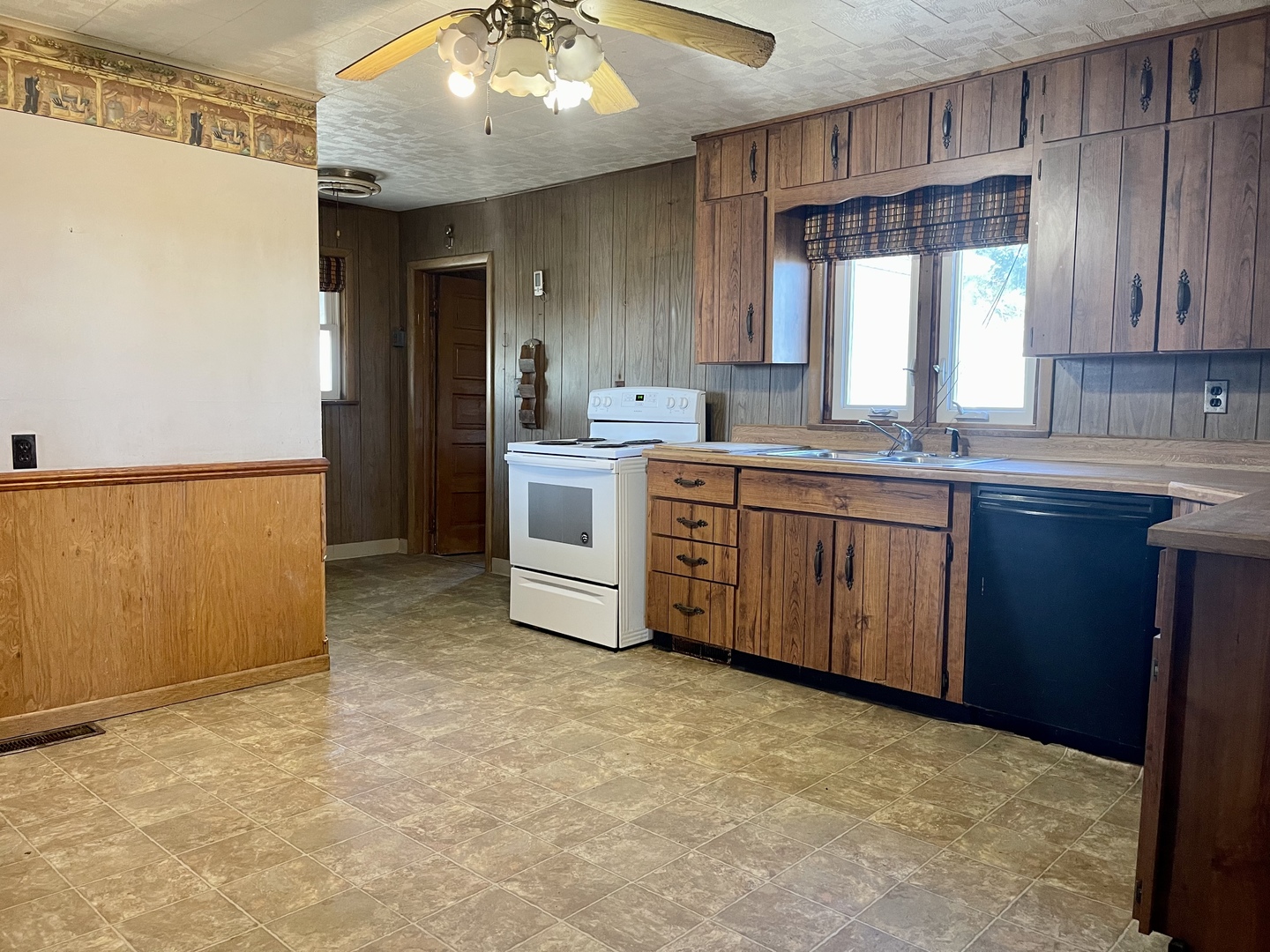 3267 East 15th Road Ottawa, IL 61350 - Photo 10 of 21 a kitchen with a sink stove and cabinets