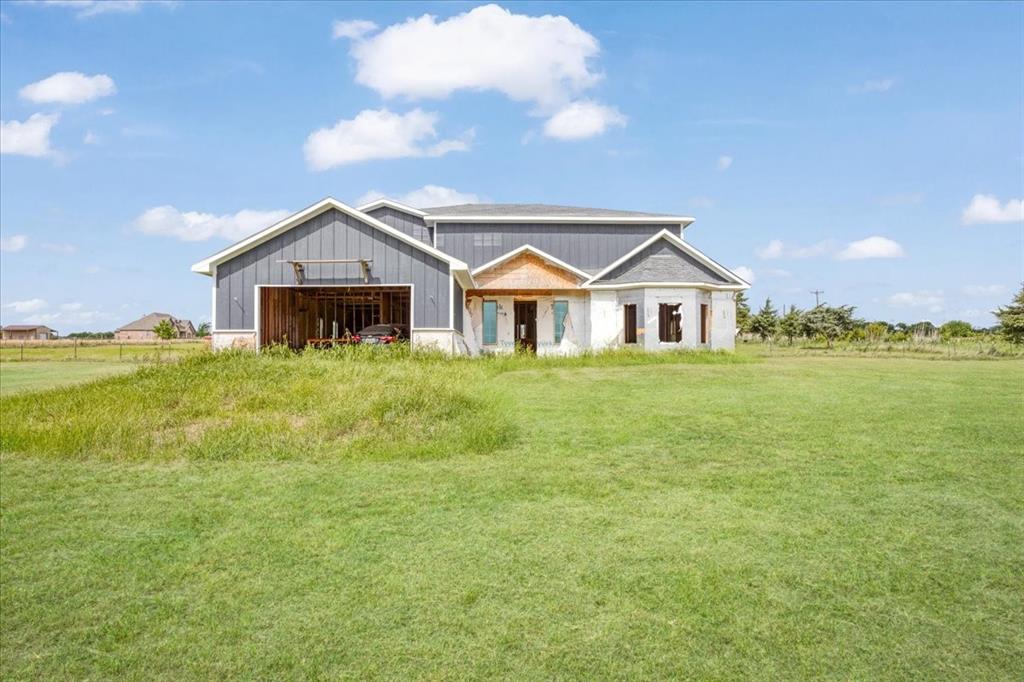 2463 County Road Bonham, TX 75418 - Photo 3 of 29 a front view of a house with a yard