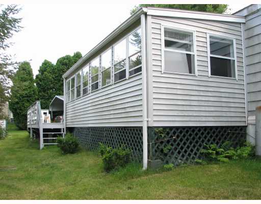 465 Gardner Road West Kingston, RI 02892 - Photo 7 of 12 Exterior Back. Rear of home showing deck area.