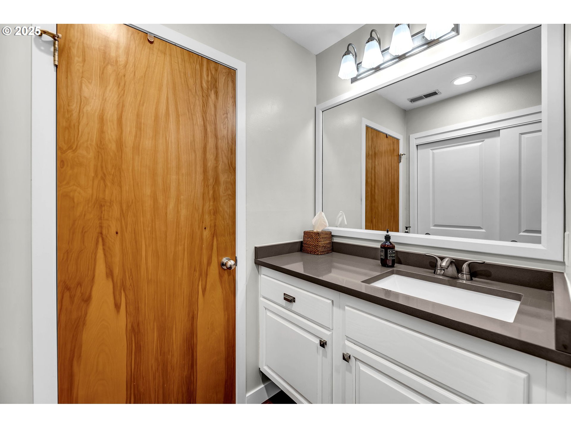 6902 Southeast Riverside Drive, Unit 6 Vancouver, WA 98664 - Photo 14 of 39 a bathroom with a double vanity sink and a mirror