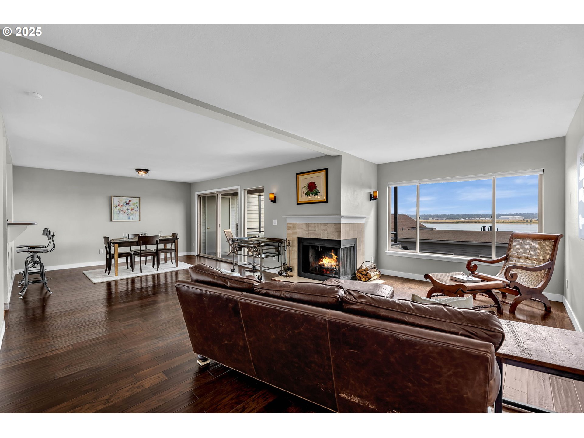 6902 Southeast Riverside Drive, Unit 6 Vancouver, WA 98664 - Photo 17 of 39 a living room with furniture a fireplace and a table