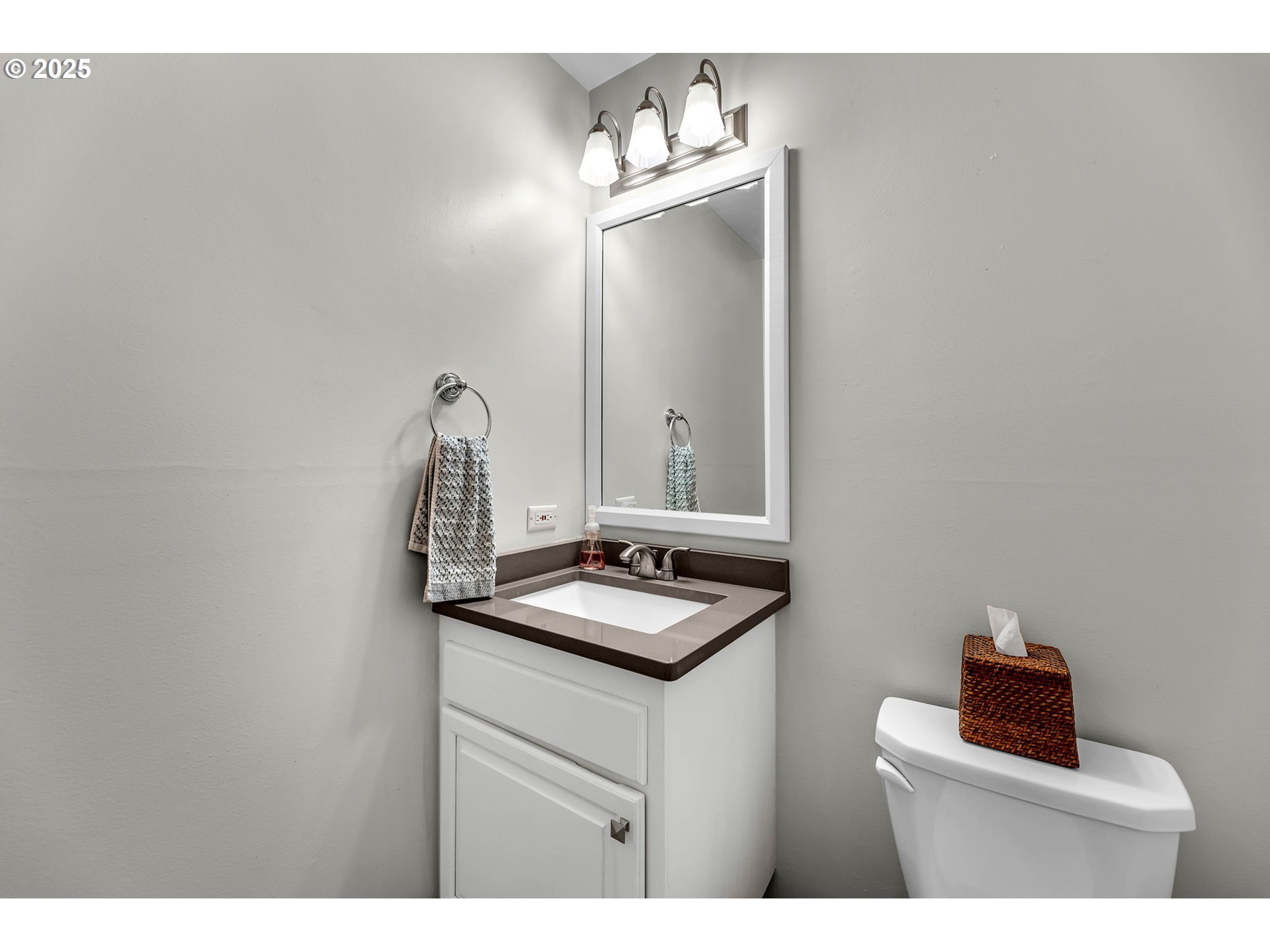 6902 Southeast Riverside Drive, Unit 6 Vancouver, WA 98664 - Photo 29 of 39 a bathroom with a sink and a mirror