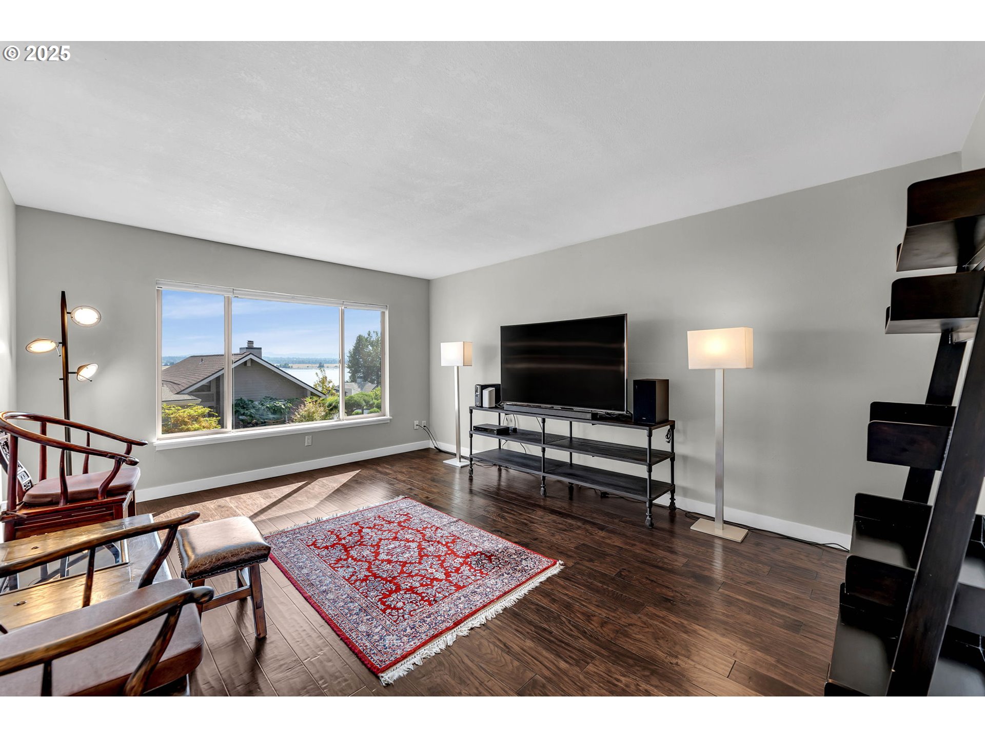 6902 Southeast Riverside Drive, Unit 6 Vancouver, WA 98664 - Photo 30 of 39 a living room with furniture and a flat screen tv