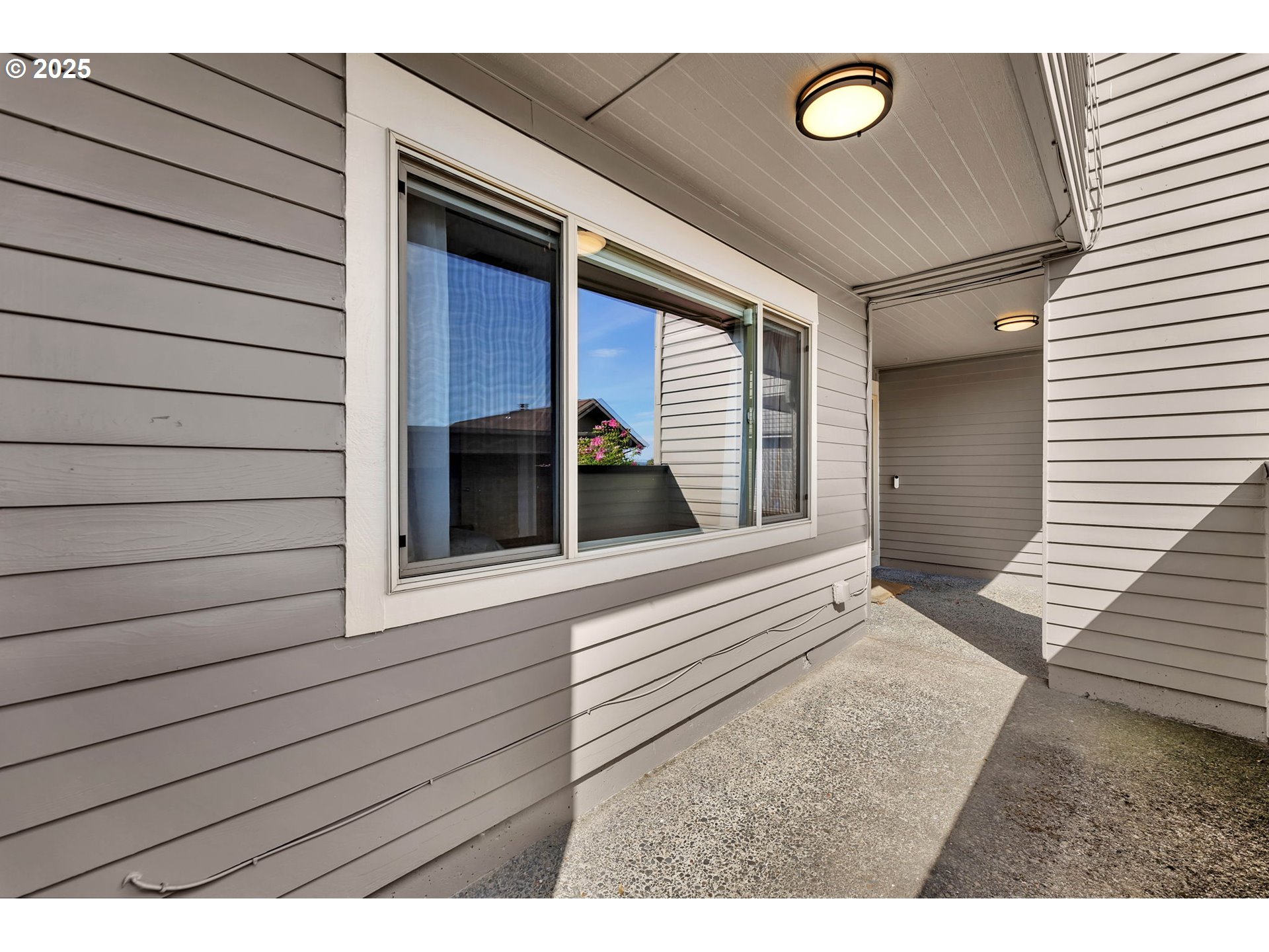 6902 Southeast Riverside Drive, Unit 6 Vancouver, WA 98664 - Photo 6 of 39 a view of a house with a door and wooden floor