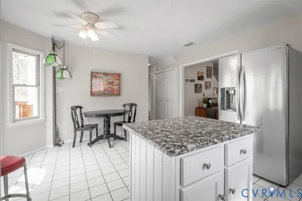 a view of kitchen island with granite countertop furniture and stove