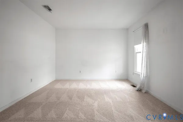 a view of an empty room with window