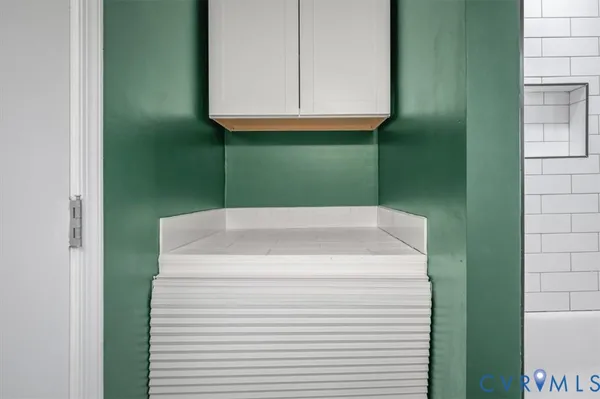 a view of a bathroom from a hallway