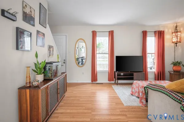 a living room with furniture and a flat screen tv
