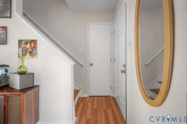 a view of a hallway with washer and dryer