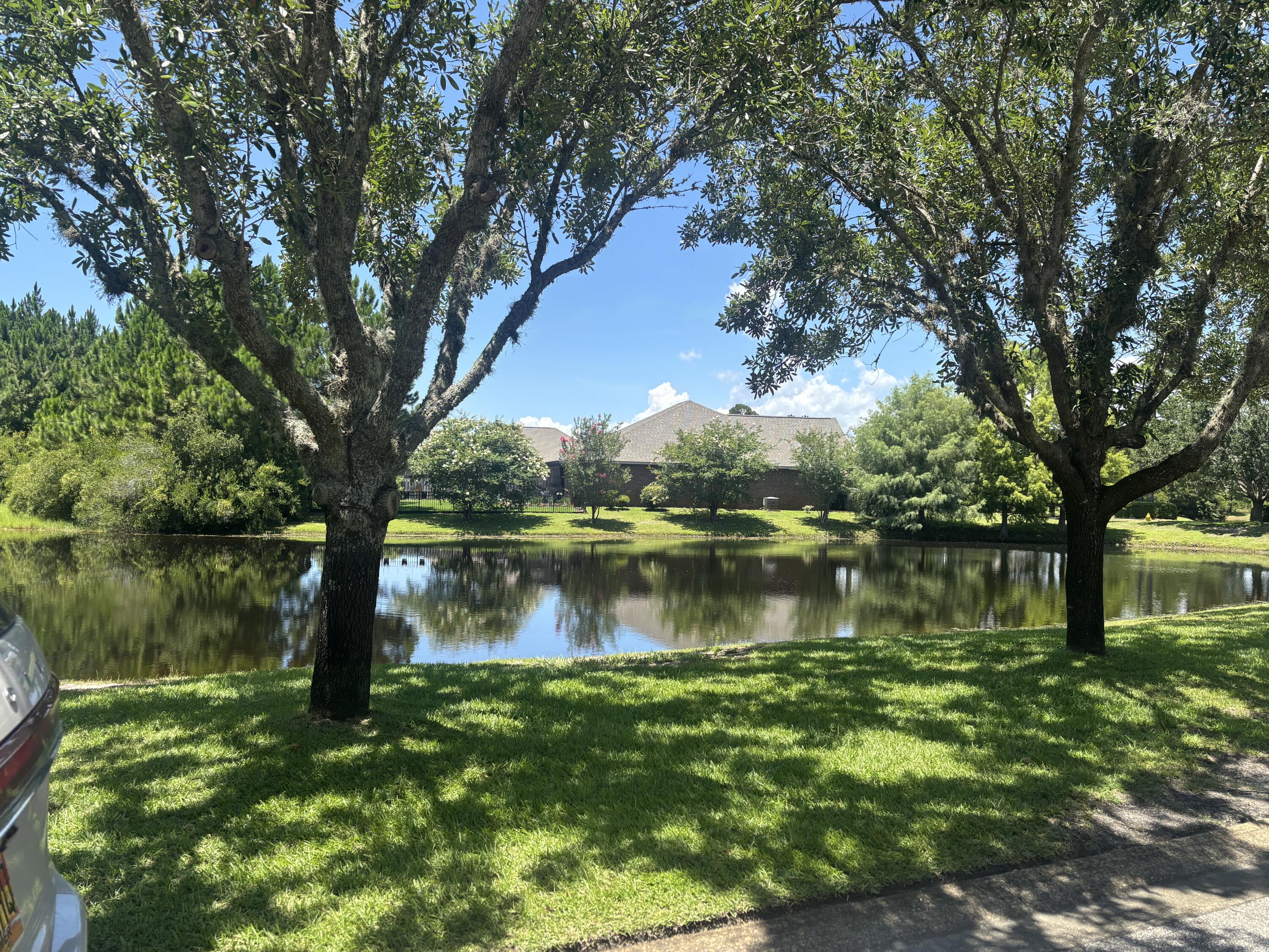 1058 Cocobolo Drive Santa Rosa Beach, FL 32459 - Photo 18 of 26 a view of a lake in a yard