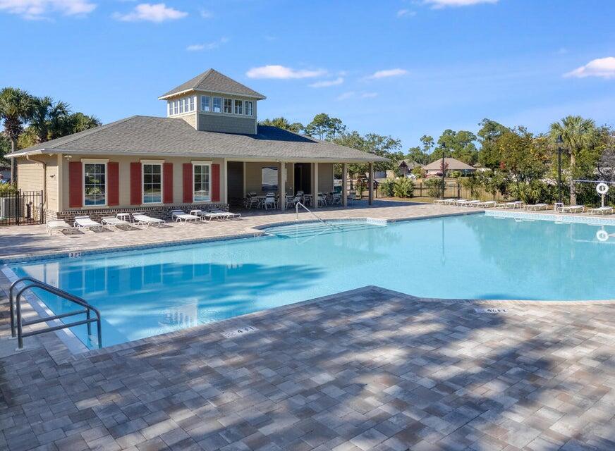 1058 Cocobolo Drive Santa Rosa Beach, FL 32459 - Photo 21 of 26 a front view of a house with garden