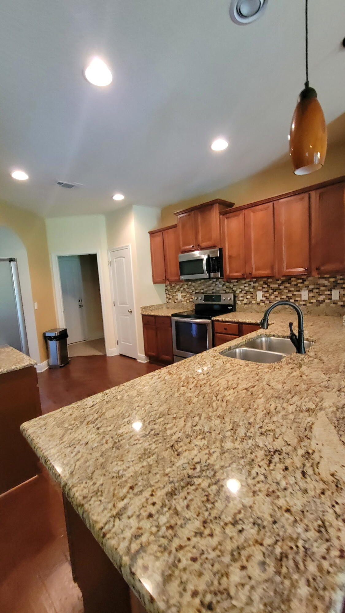 1058 Cocobolo Drive Santa Rosa Beach, FL 32459 - Photo 6 of 26 a kitchen with stainless steel appliances granite countertop a sink a stove top oven a counter space and cabinets