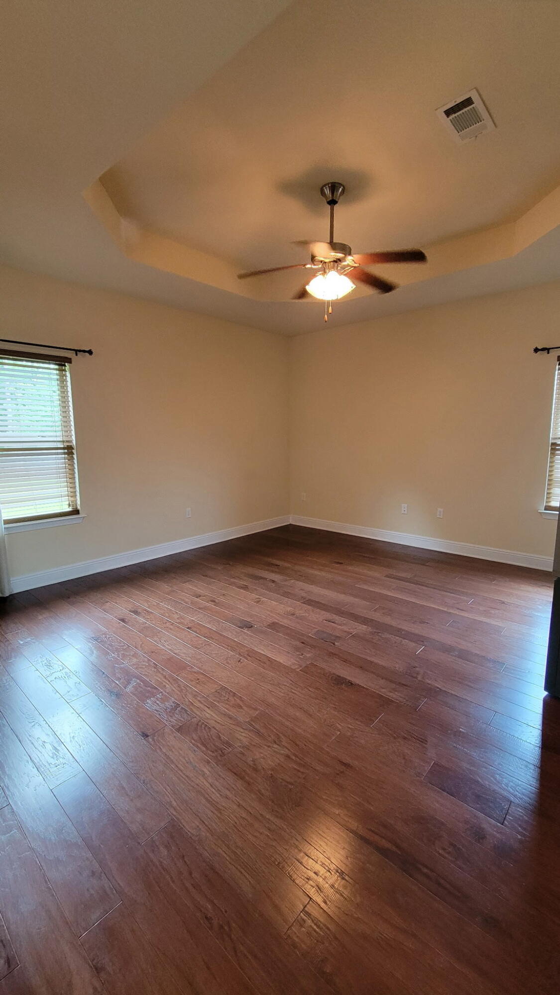 1058 Cocobolo Drive Santa Rosa Beach, FL 32459 - Photo 7 of 26 a view of room with wooden floor and ceiling fan