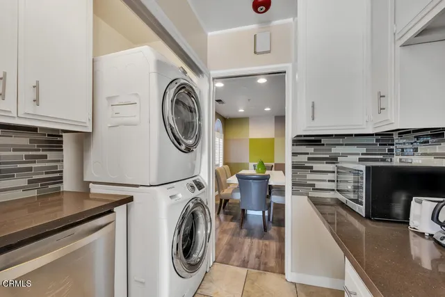 a view of a kitchen with washer and dryer