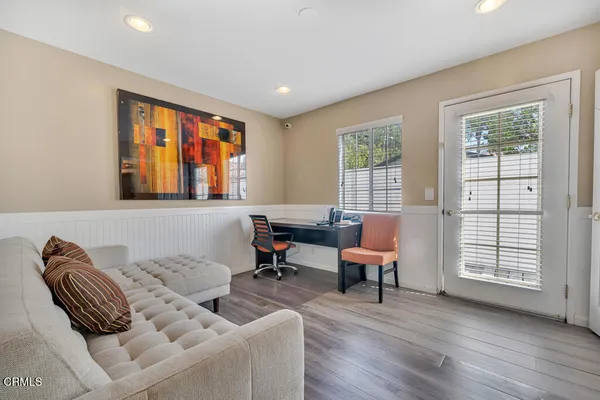 a living room with furniture and a window
