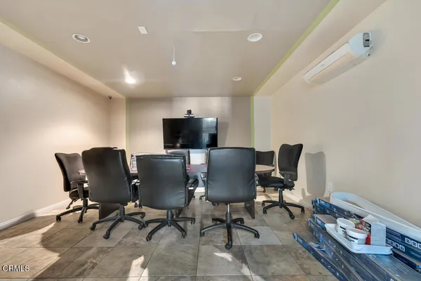 a view of a workspace with furniture