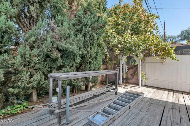 a view of a balcony with wooden floor