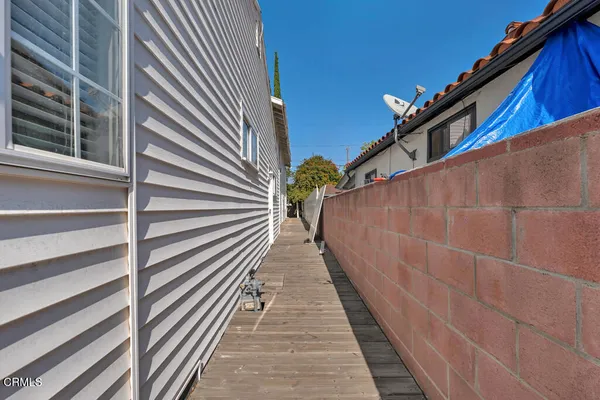 a view of balcony with wooden floor and stairs