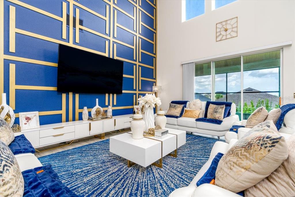 1296 Waterview Ridge Circle Apopka, FL 32703 - Photo 17 of 60 a living room with furniture fireplace and a flat screen tv