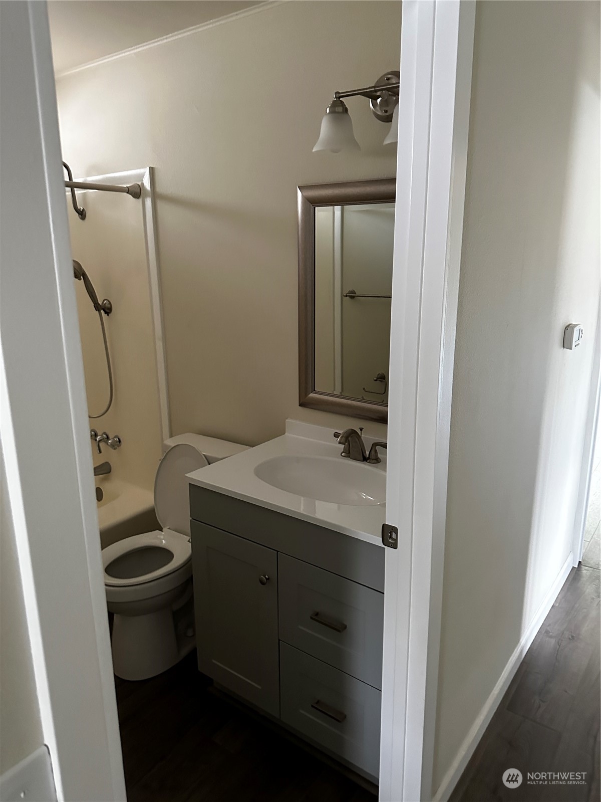 201 Union Avenue Southeast, Unit 90 Renton, WA 98059 - Photo 13 of 22 a bathroom with a granite countertop sink toilet and shower