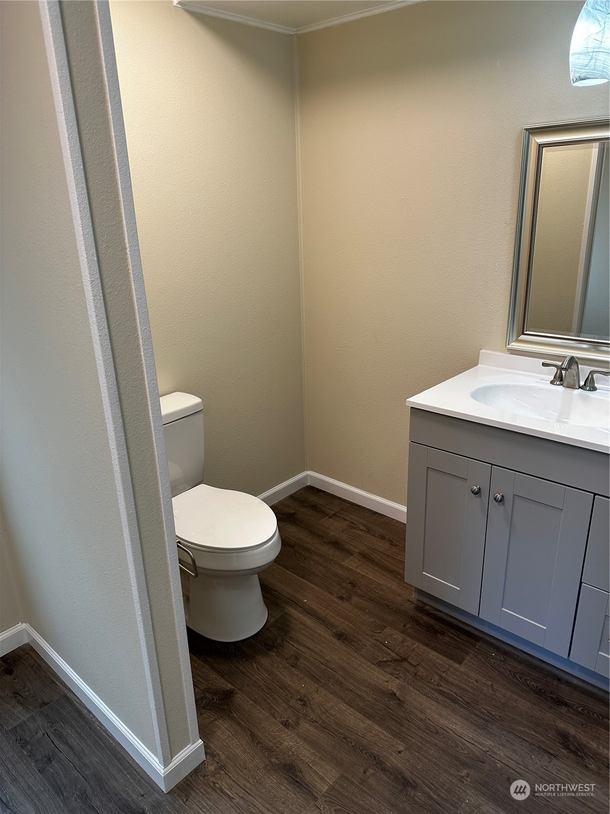 201 Union Avenue Southeast, Unit 90 Renton, WA 98059 - Photo 16 of 22 a bathroom with a toilet a sink and mirror